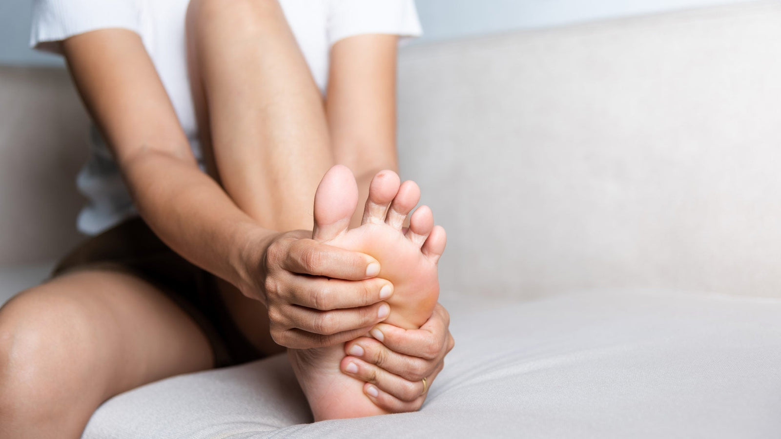 Image of a woman massaging her foot