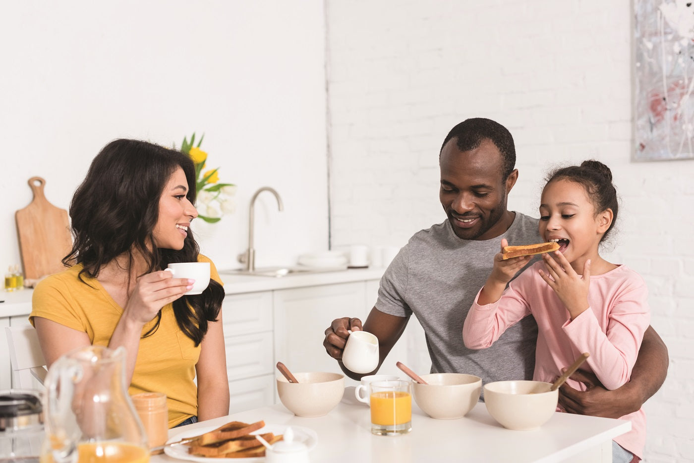 Family eating breakfast together