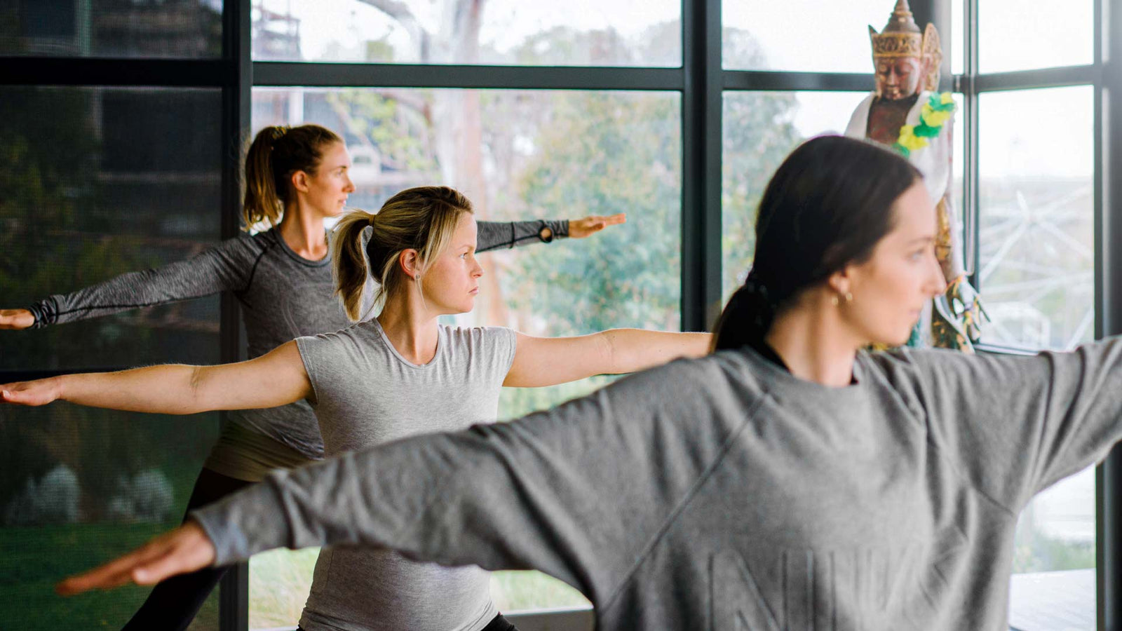 Group of women performing tai chi exercise