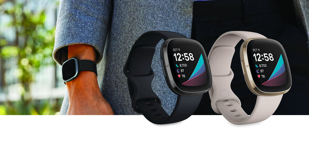 Two Fitbit Senses and man's wrist