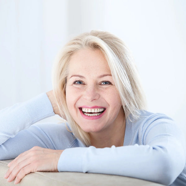 woman with white hair laughing