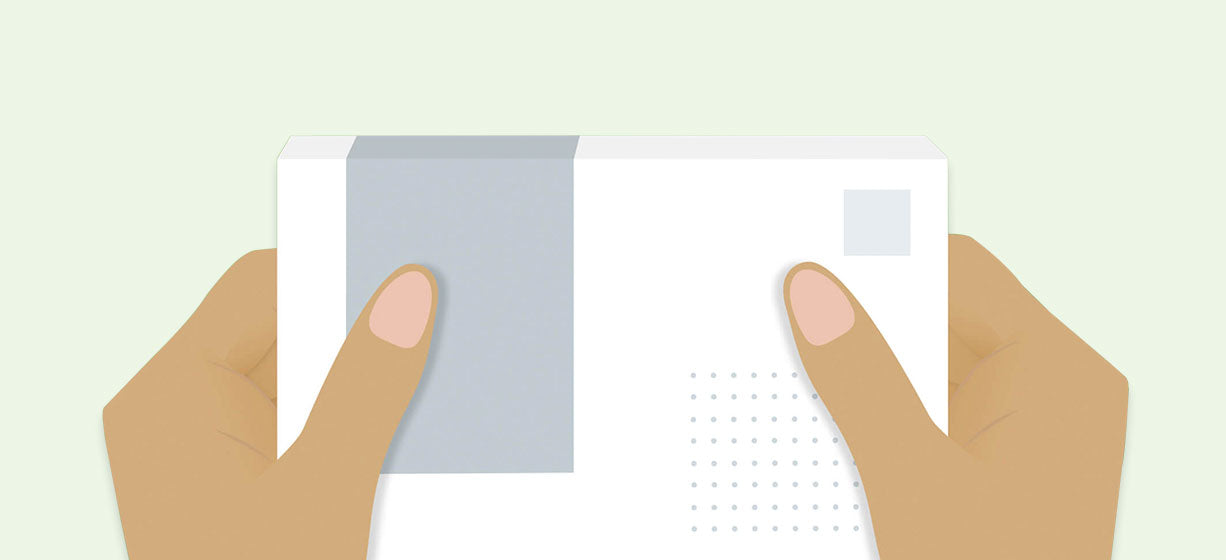 Illustrated hands holding COVID-19 test box