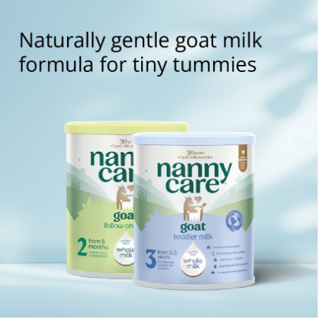 Two tins of Nanny Care goat milk formula on a light blue background