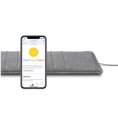 Withings Sleep Analyzer sleep tracking mat with mobile app display on a white background